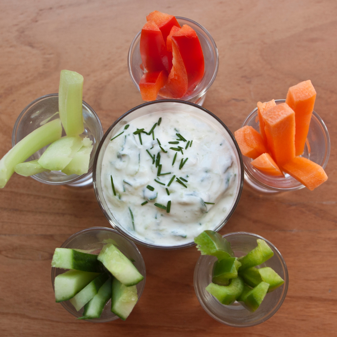 cups of vegetable sticks and sour cream dip